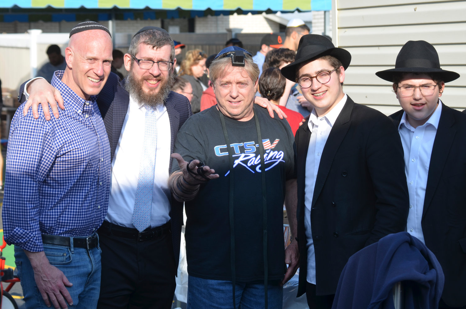 Scott Cushing, Rabbi Kramer, Alan Cohen, wearing tefillin, Michoel Duboff and Sholom Weinbaum.