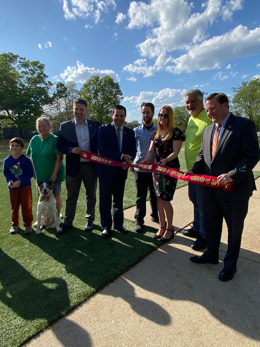 County Legislators John Ferretti and Tom McKevitt with community officials, Richie Krug Jr.,and Frank Camarano Jr., and residenrs cut the ribbon for the upgraded dog park on May 17.