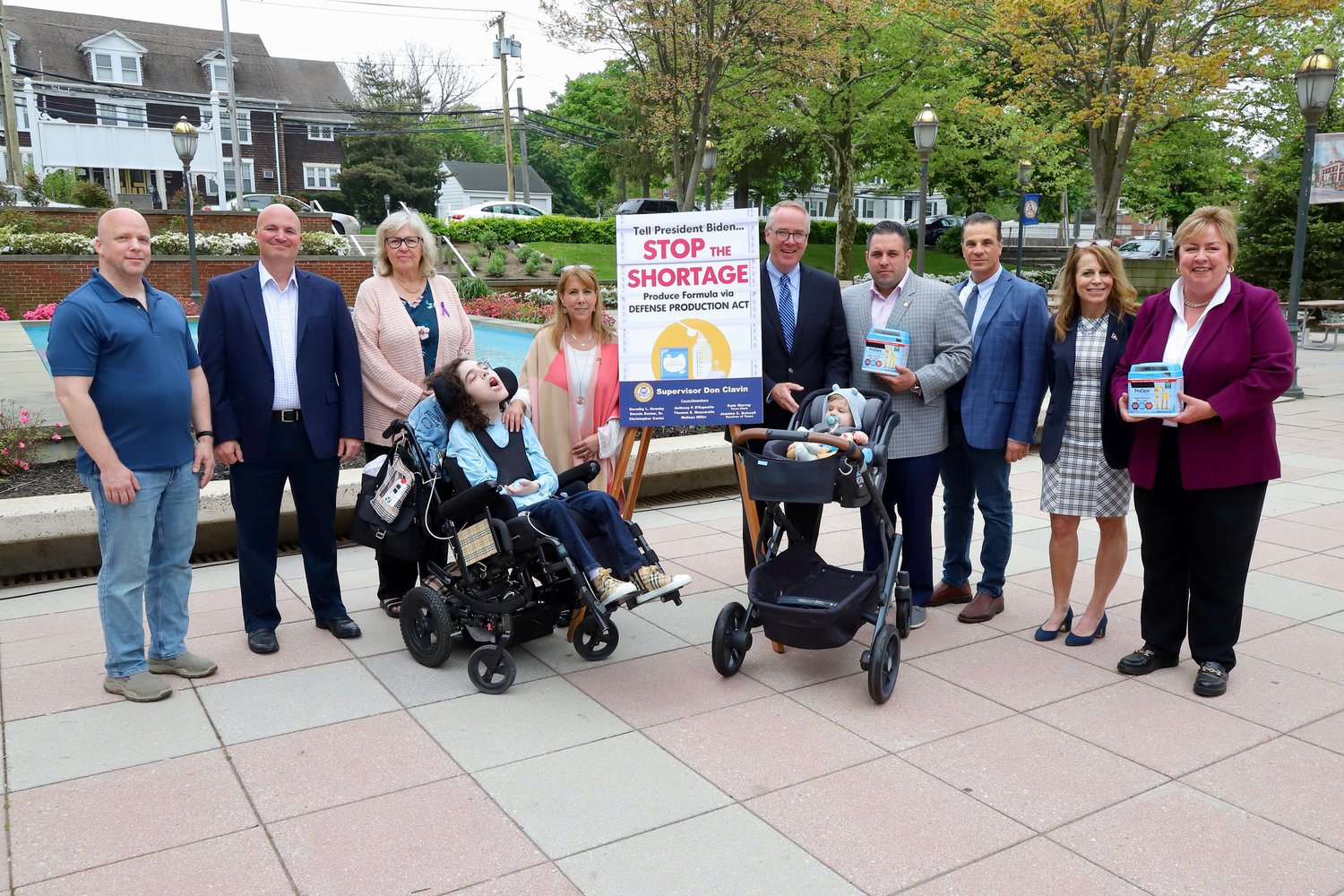 Hempstead town officials and parents called on Congress to speed up production of baby formula. Among those making the statement were, from left, John Caputo of Lynbrook, Councilman Chris Carini, Legislator Denise Ford, Oliver Miller and mother Councilwoman Melissa Miller, Town of Hempstead Supervisor Don Clavin, Councilman Anthony D’Esposito, Councilman Tom Muscarella, Receiver of Taxes Jeanine Driscoll and town clerk Kate Murray.