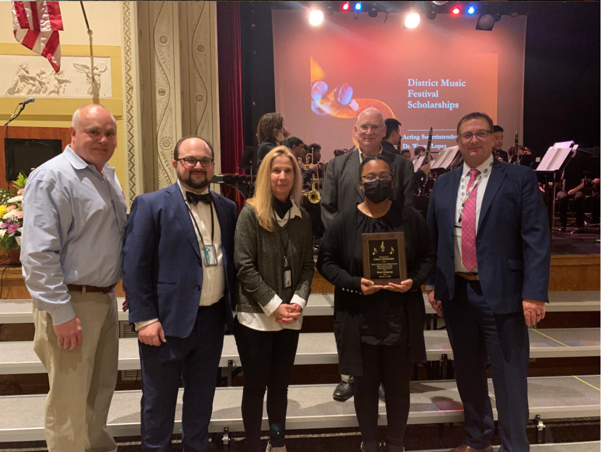 North High School’s music scholarship recipient Lucy Wu, fourth from left, with President Maier, from left, Trustee Pomerantz, Dr. Erdos, Vice President Cummings and Dr. Loper.