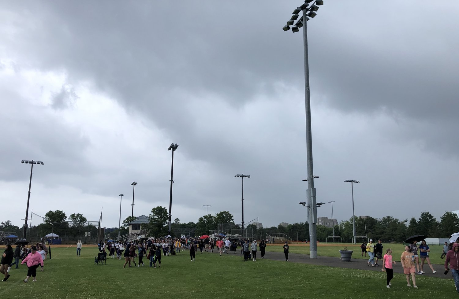 Spectators headed for the exit Saturday at Mitchel Athletic Complex as severe weather forced the Nassau H.S. softball championships to postpone to Sunday.