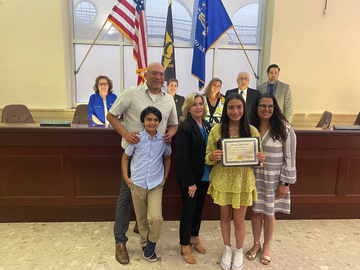 Sarai Fernandez, holding certificate, received a citation from Mayor Pamela Panzenbeck on May 24 for donating $1,800 to the Glen Cove Youth Services and Recreation Department to help underprivileged children take participate in the city’s youth programs.