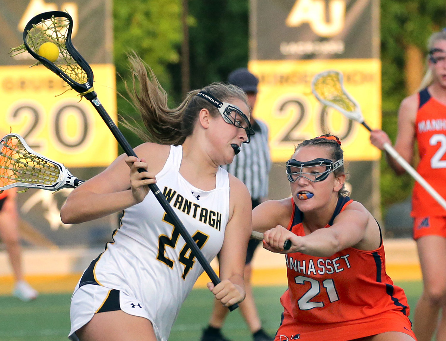 Wantagh’s Riley Forthofer, left, drove to Manhasset’s cage during the Nassau Class C championship game May 31 at Adelphi.