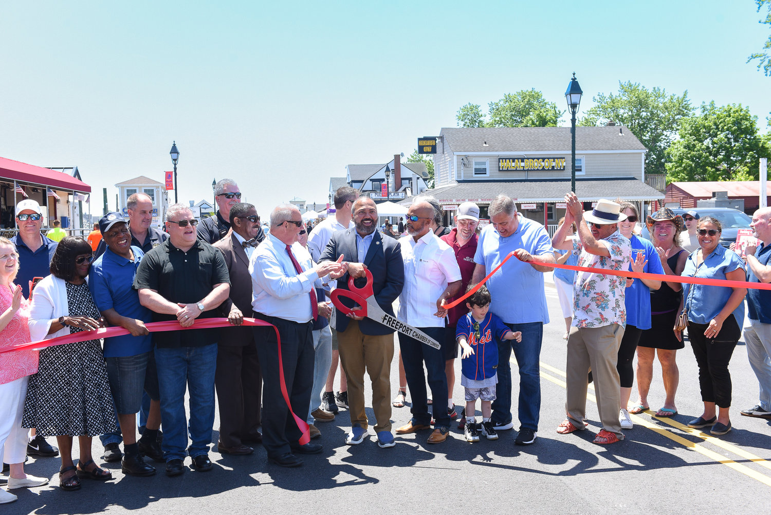 State Sen. Kevin Thomas cut the ribbon for the official kickoff to Freeport's 32nd Annual Nautical Mile Festival.