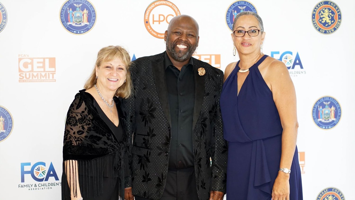 FCA’s Hempstead Prevention Coalition administers the GEL Summit. HPC director Thurston O’Neal, center, attended the May 17 graduation event, as did Donna Teichner, LCSW,  assistant vice president of Prevention and Family Support FCA, and JoAnn Alexander, FCA administrative coordinator.