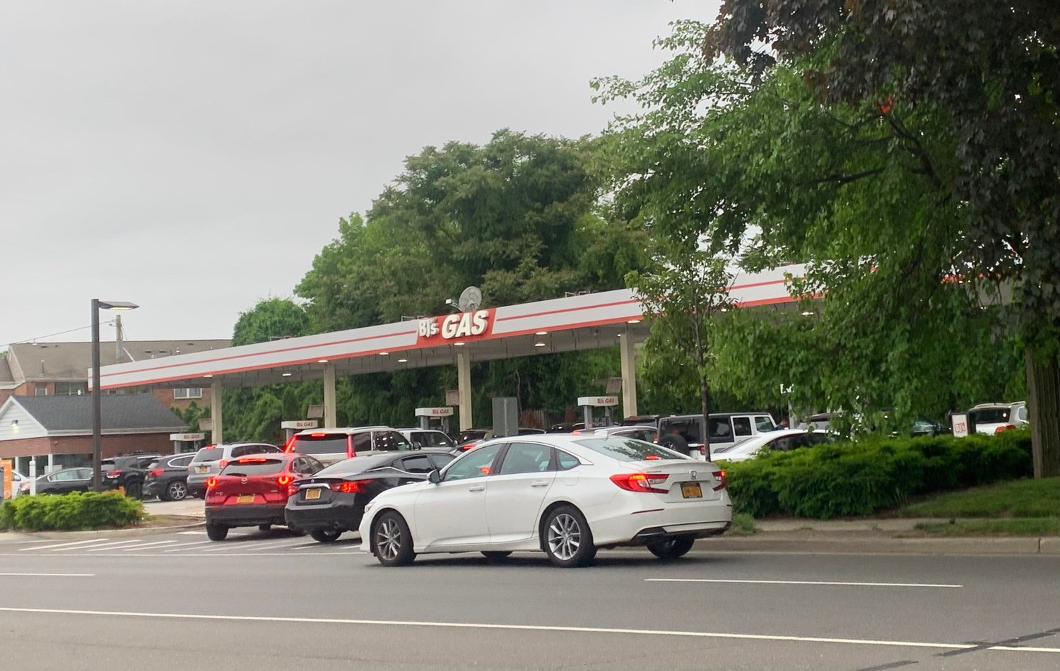 A line of cars at a gas station after the tax holiday went into effect on June 1.