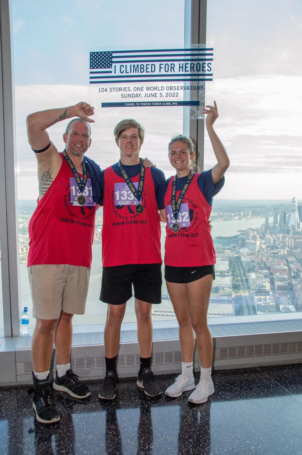Erik Mahler with his son, Brady, and daughter, Kirsten, after climbing 104 stories at One World Trade Center on June 5.