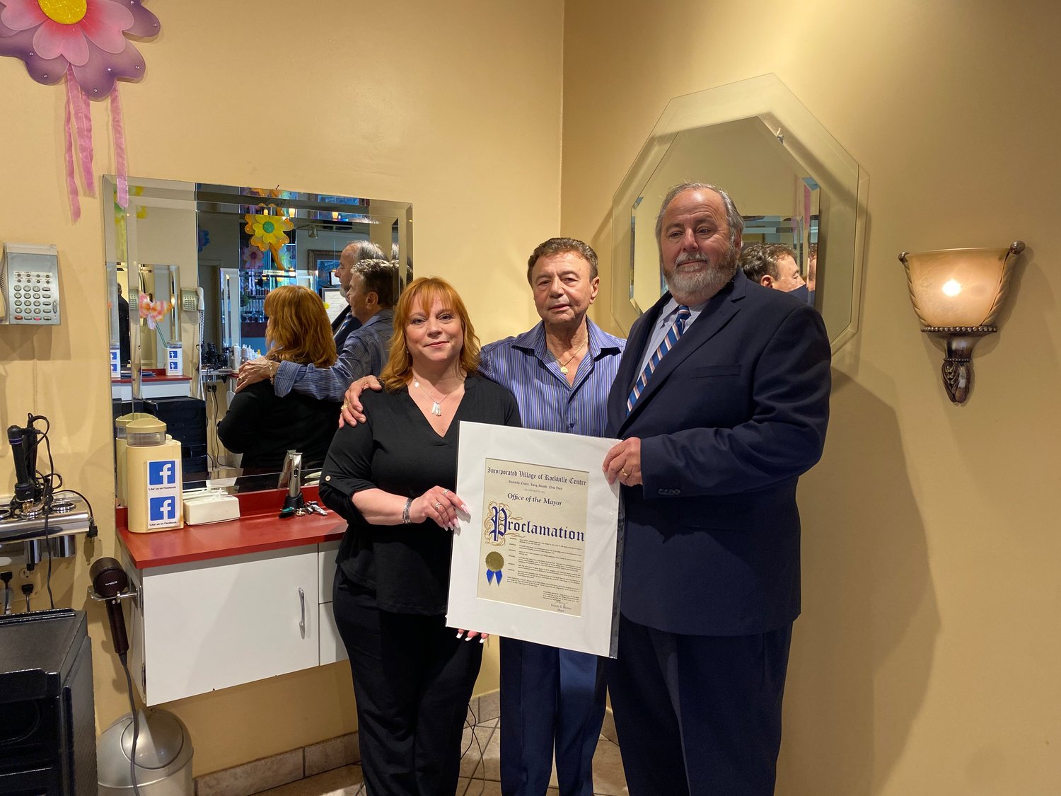 Leonardo’s owner Annemarie Bedell, her father James Bilello, and Mayor Francis Murray celebrated the 50th anniversary of the hair salon on North Long Beach Road last Wednesday.