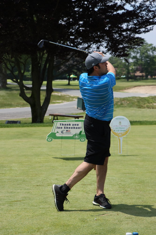 Brandon Carmody tees off during the outing at the Rockville Links’ course.