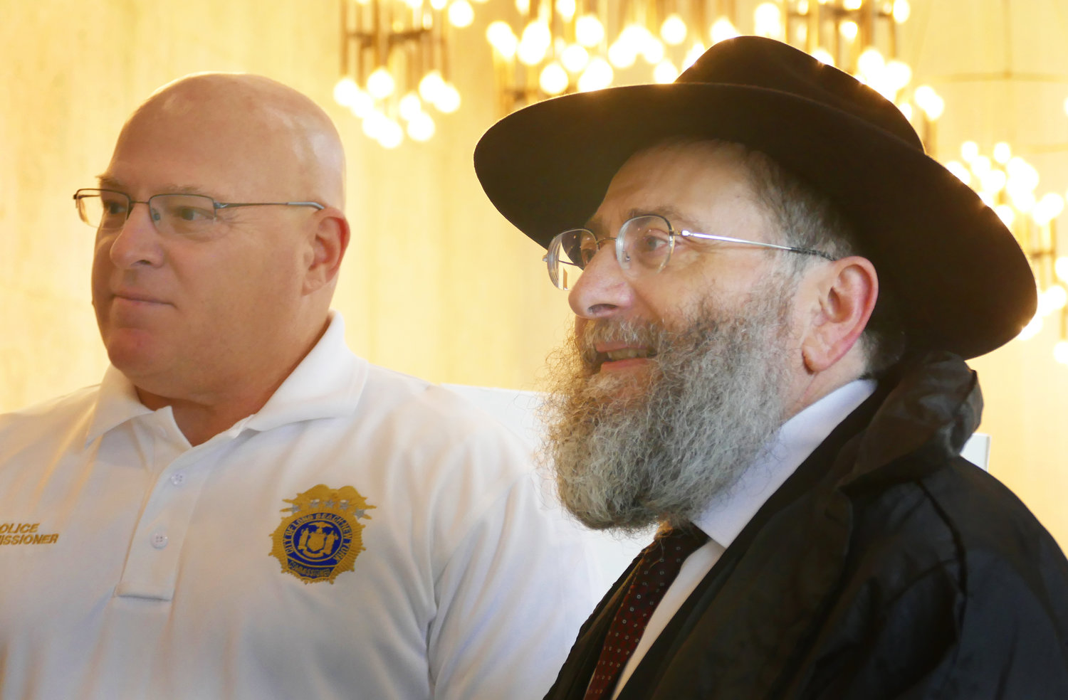Rabbi Eli Goodman, spiritual leader of the Chabad of the Beaches, discussed the event with Long Beach police commissioner Ron Walsh.