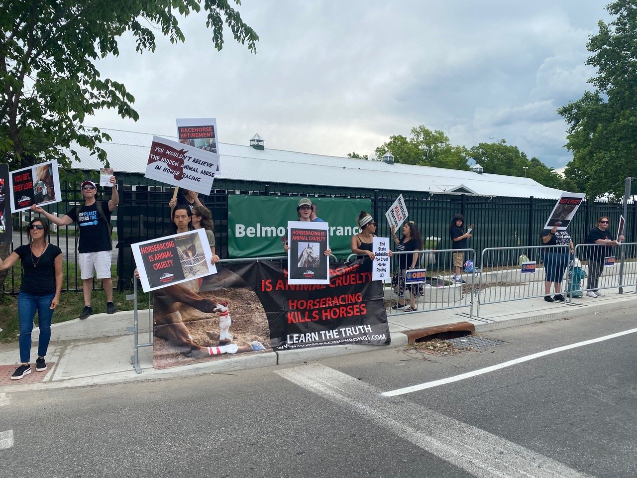 Over 100 animal rights activists chanted and held signs outside Belmont Park for three hours prior to the Belmont Stakes.