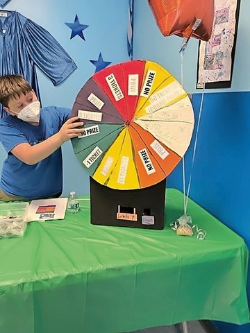 A colorful cardboard wheel enticed players to try for prizes at the Cardboard Carnival mounted at Northern Parkway School in Uniondale.