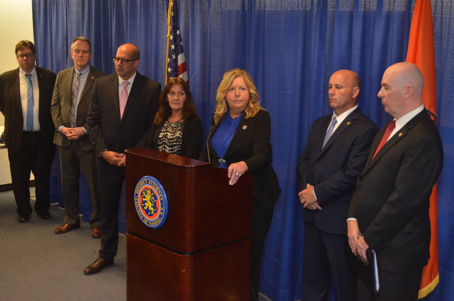 Darlene Altman, fourth from L., was 4 years old when her mother, Diane Cusick, 23, was allegedly murdered in her car at the Green Acres parking lot on February 15, 1968. Nassau County district attorney, Anne Donnelly, hosted a press briefing following the arraignment proceedings.