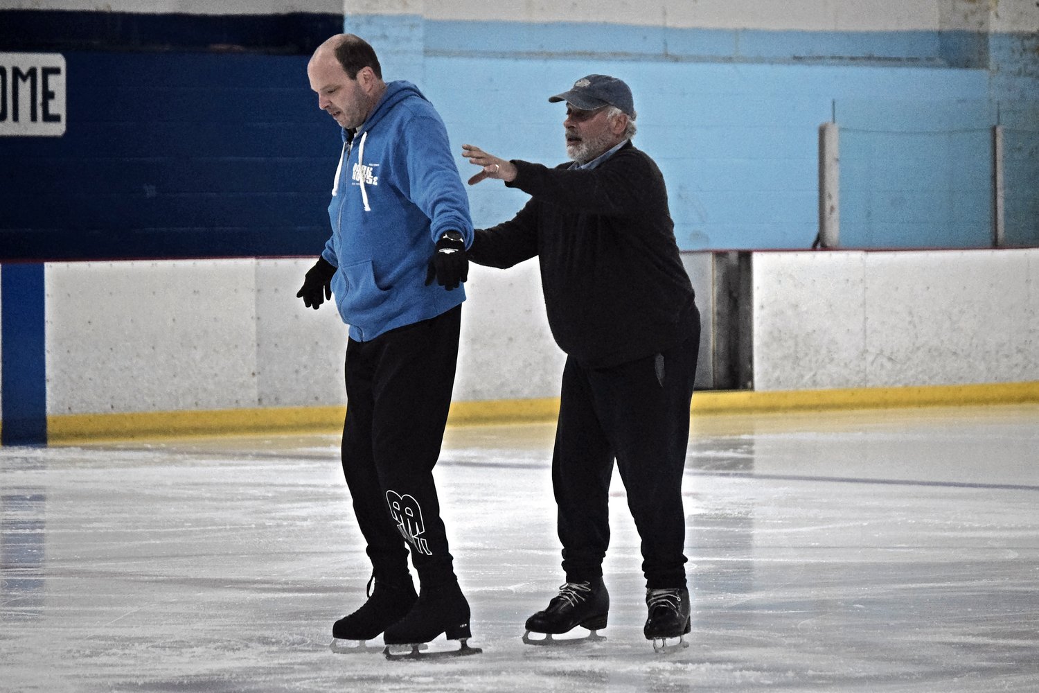 Mark Getman received hands-on instruction from his coach, Adam Leib, at Iceland skating rink on June 9.