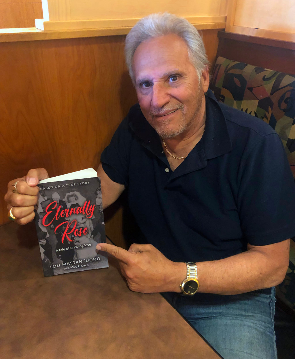 Lou Mastantuono, Wantagh resident and author, with his book, "Eternally Rose".