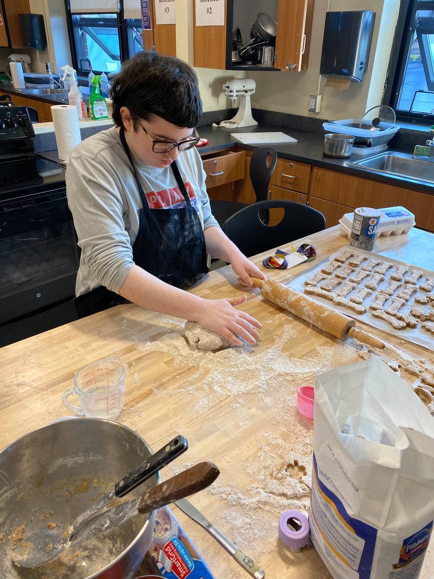 Junior Rena Pearlman makes dog treats in another prevocational program.