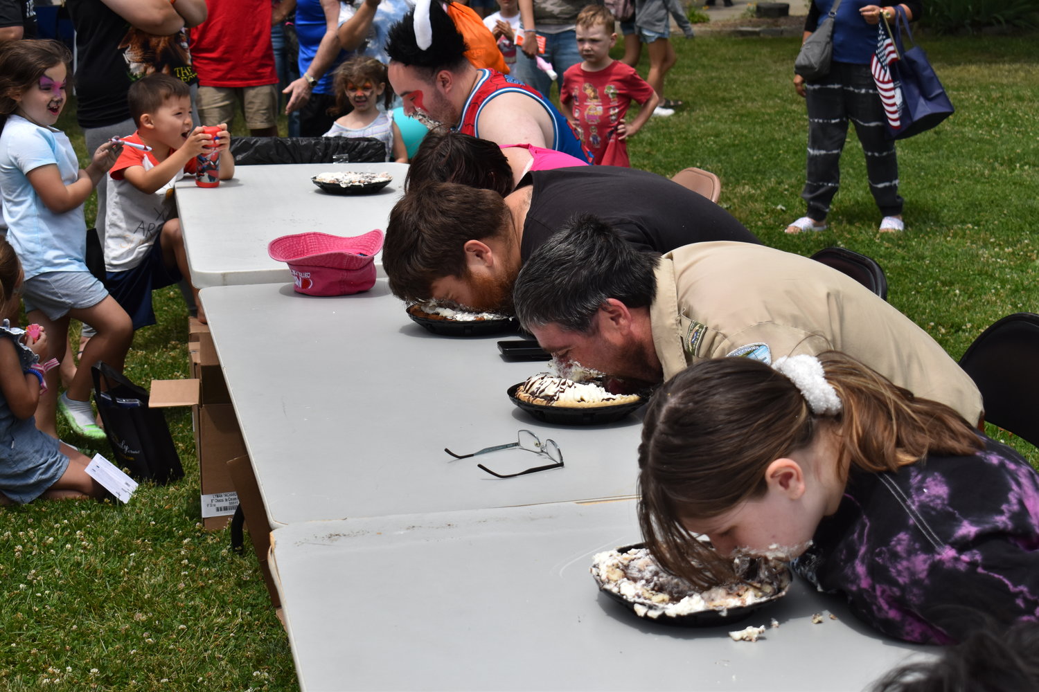 The pie eating contest, with pies donated by Stew Leonard’s in East Meadow, got the crowd all excited.