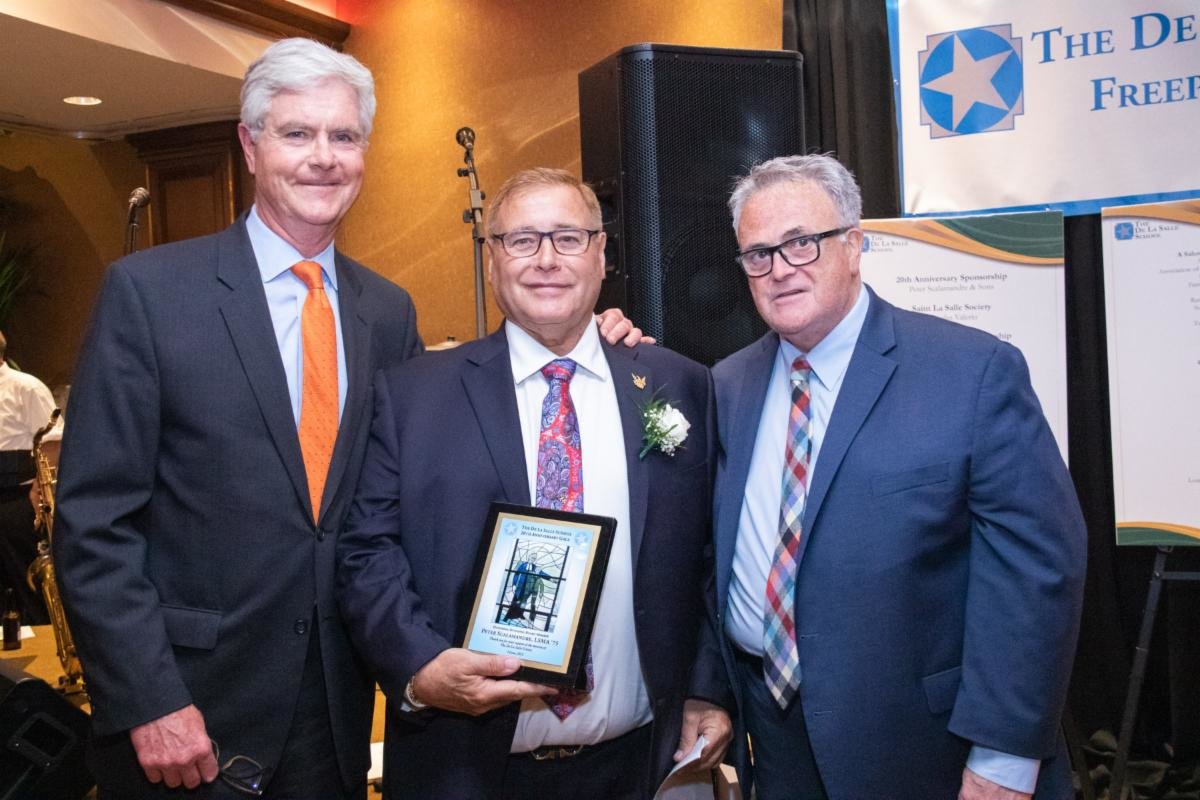 Peter Scalamandre, center, a founding member of De La Salle School, was honored at the 20th Anniversary Gala on June 3. 