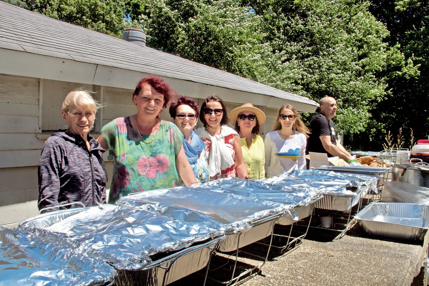 Maria Szherba, far left, Halyna Fenchenko, Anna Kijko, Ivanna Duda, Tetyana Komzuk and Iryna Bodnar were on hand to serve homemade Ukrainian food at the Father’s Day picnic at St. Josephat’s, a fundraiser for the war-torn country.