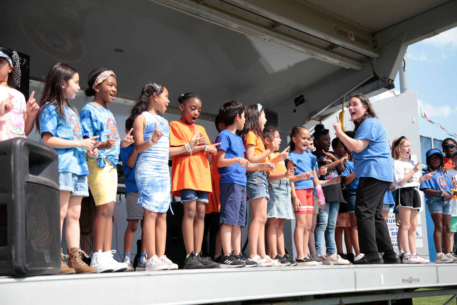 Members of the Maurice W. Downing 2nd grade Glee Club, led by Mishel Wowk, entertained the crowd with their rendition of "Stand By Me."