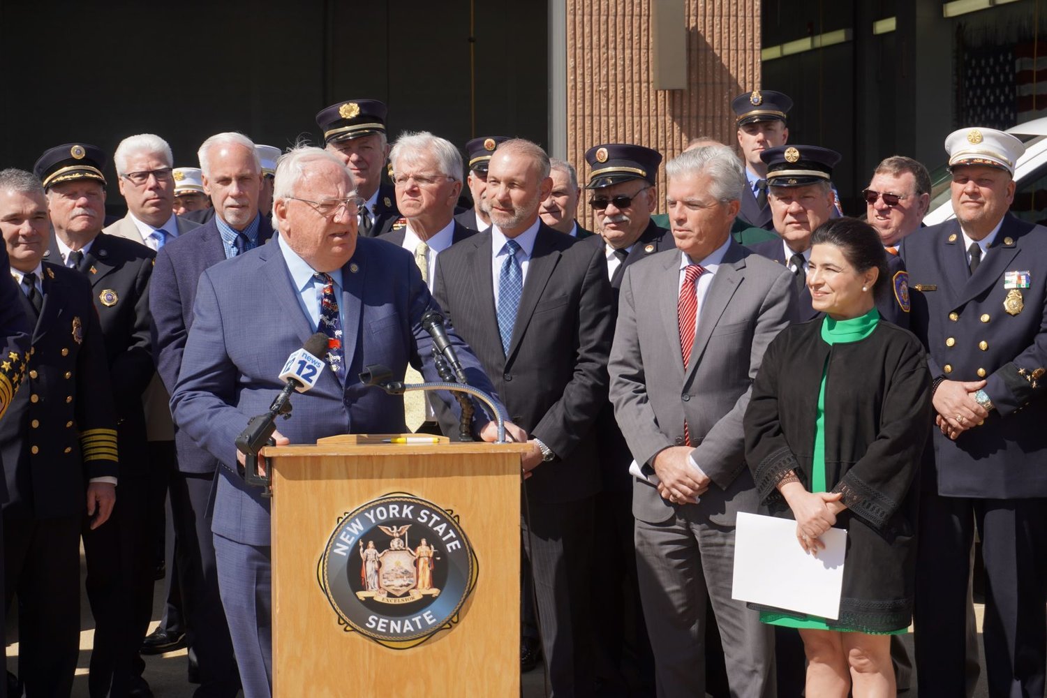 Earlier this June, Senator John E. Brooks, Suffolk County Executive Steve Bellone, Senator Anna Kaplan, Assemblymembers Fred Thiele and Steve Stern, and various state and local volunteer Firefighter organizations came together at the East Farmingdale Fired Department to announce the inclusion of the EMS Cost Recovery Act (Senate Bill S7186A) in the NY State Budget; and discuss its implications for volunteer emergency services across the state. Put simply, the EMS Cost Recovery Act allows allows volunteer fire departments to recover costs for emergency medical services (EMS) rendered. 