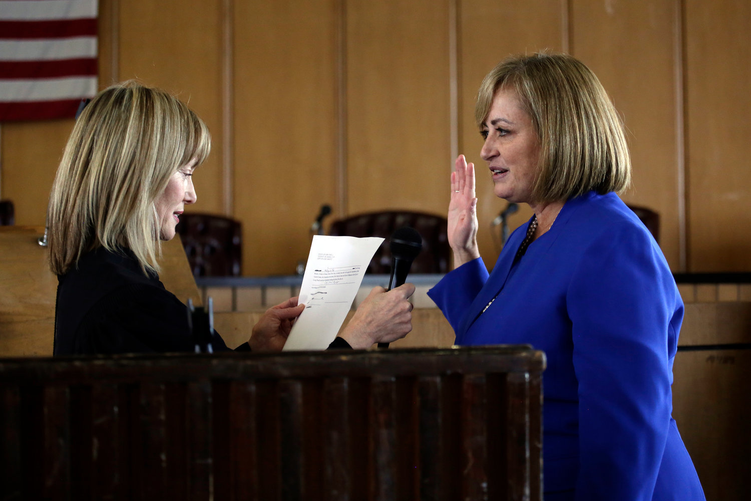 Karen McInnis is sworn in to serve on the Long Beach City Council, which is now dominated by women, 3-2.
