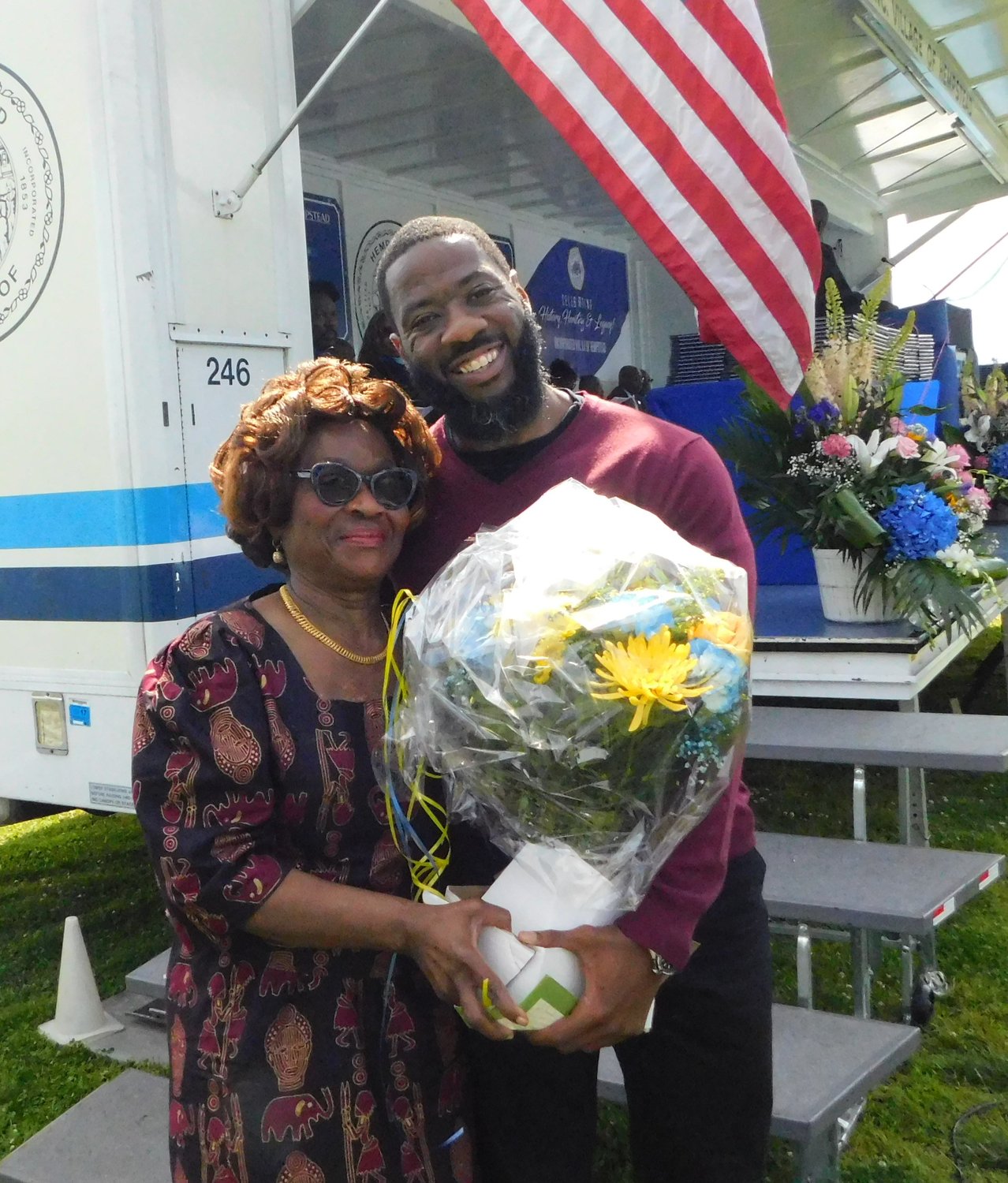 Elianne Antoine and Christopher Jean-Pierre, the mother and brother of White House press secretary Karine Jean-Pierre, received flowers from local dignitaries at the Hempstead High School graduation ceremony.