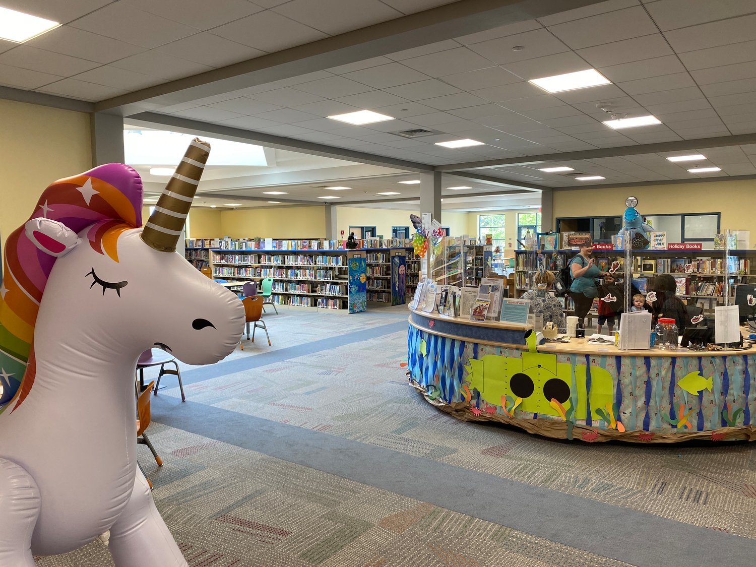 The bright and colorful children’s room, with a welcoming inflatable unicorn at the entrance.