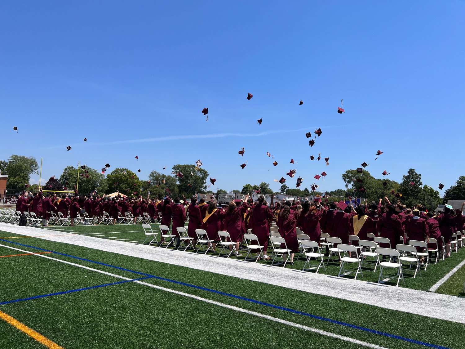 W.T. Clarke High School graduates tossed their caps in the air after their graduation ceremony on June 26.