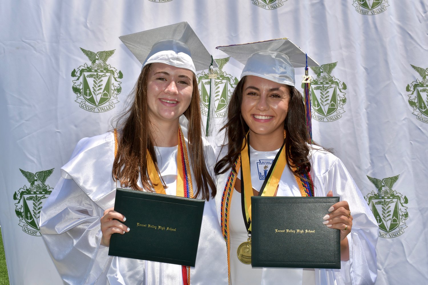 Locust Valley High School valedictorian Elizabeth Gresalfi, left, and salutatorian Nicole Berritto, far left.