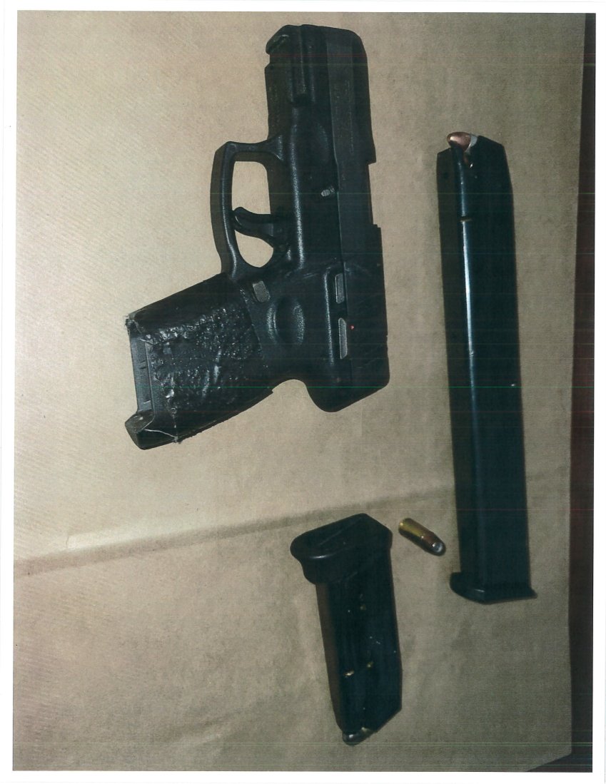 The gun, the magazine and high-capacity loader that two Brooklyn residents were allegedly found with in Inwood Park on June 30.