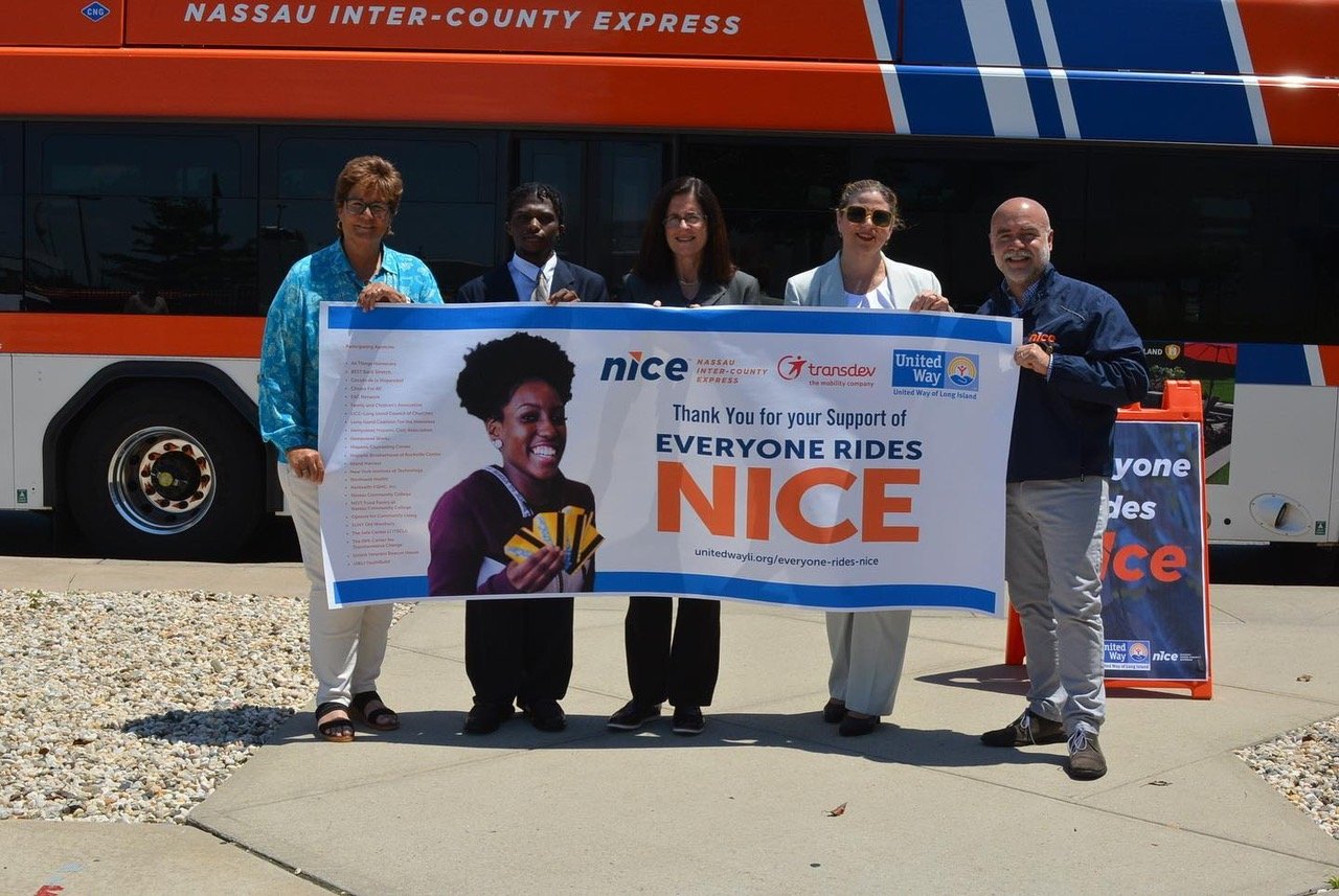 Jack Khouz, right — chief executive of NICE Bus, unveiled this year’s plan for his Everyone Rides NICE program, which provides free rides for families struggling economically.