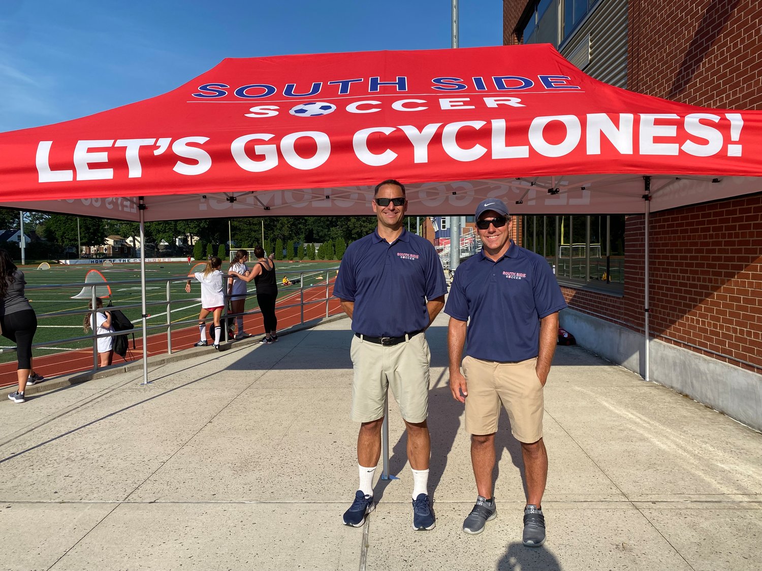 South Side boys varsity head Coach Pat Corvetti, left, and assistant coach Chuck Phelan, right, held the team's first summer camp last week.