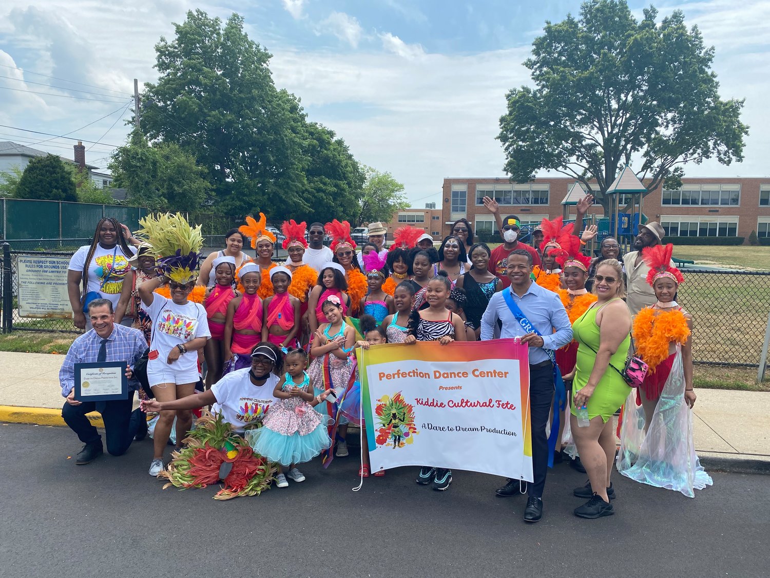 Dance school leader Petra Brathwaite, Nassau County Legislator Carrie Solages, students at the dance school and their parents before the parade that kicked off the festival began.