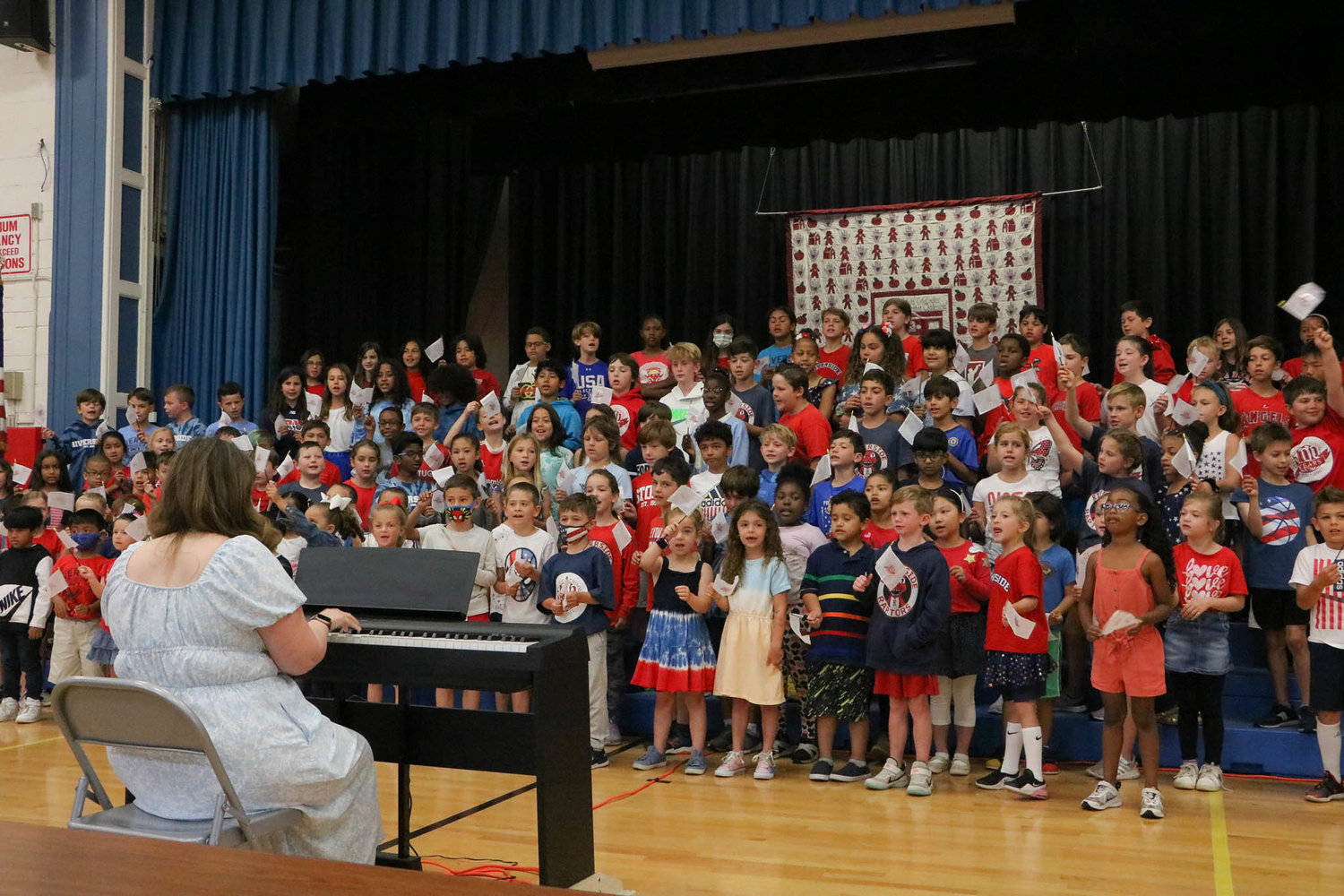 RIverside students sing "You're a Grand, Old Flag."
