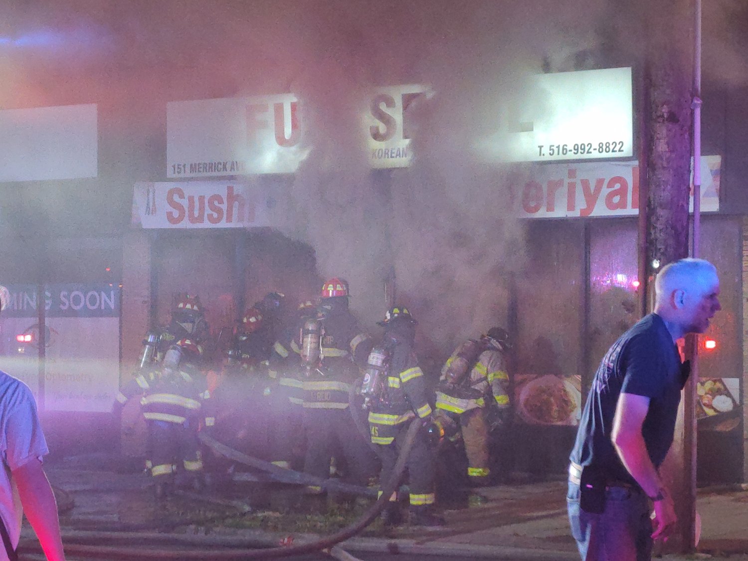 Smoke was pouring out the Fuji Seoul Restaurant Wednesday night in Merrick as firefighters battled the blaze.