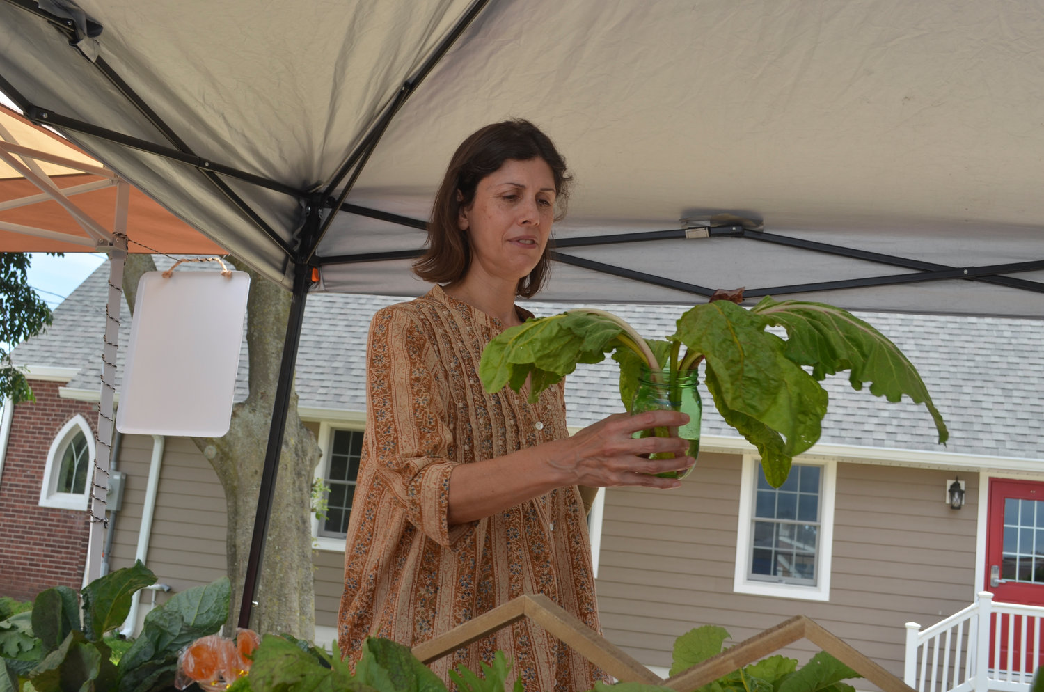 Rebecca Tory from Bellmore checked out a vegetable for sale.