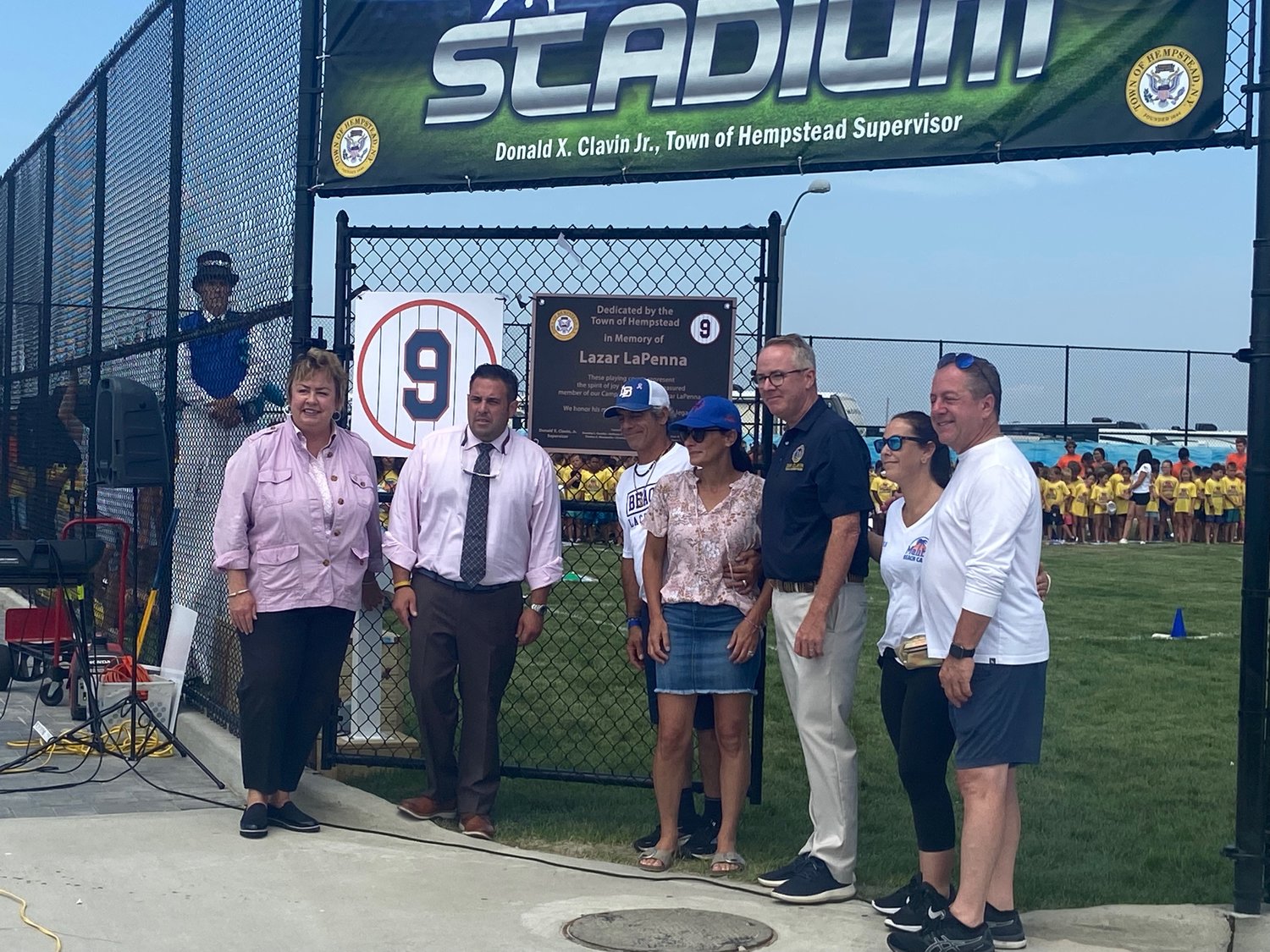 Don Clavin was joined by Gregg and Monique LaPenna and other town officials to announce the dedication of MAalibu Beach Cub fields to Lazar Thursday.