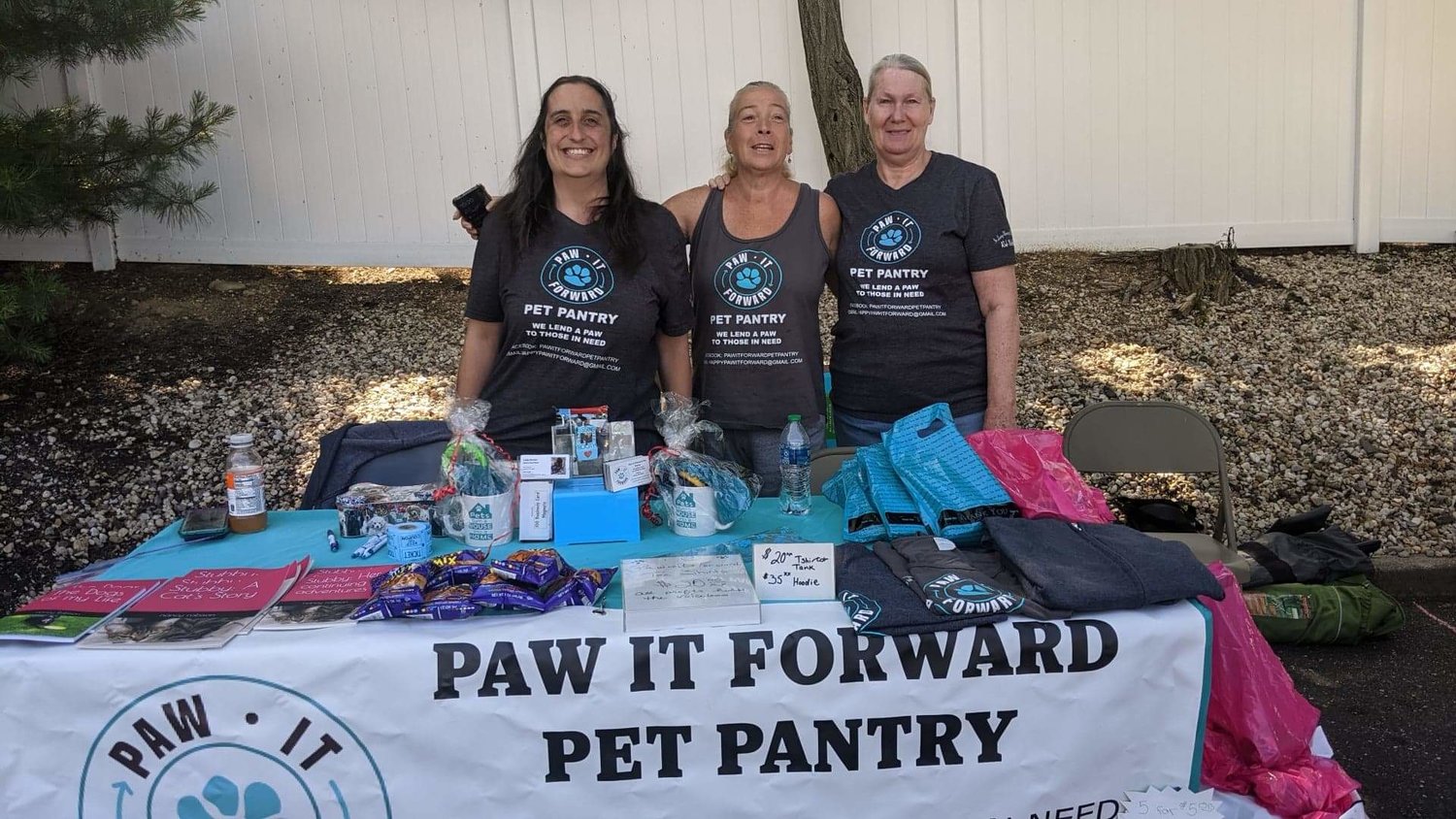 Daniella Scala-Nathan, owner of Paw it Forward, first from left, assessed the main pantry drop-off box with volunteers Linda Guckian and Shari Ehrlich. Scala-Nathan is planning a fundraiser Aug. 20 to help build a new storage shed primarily for cat food.