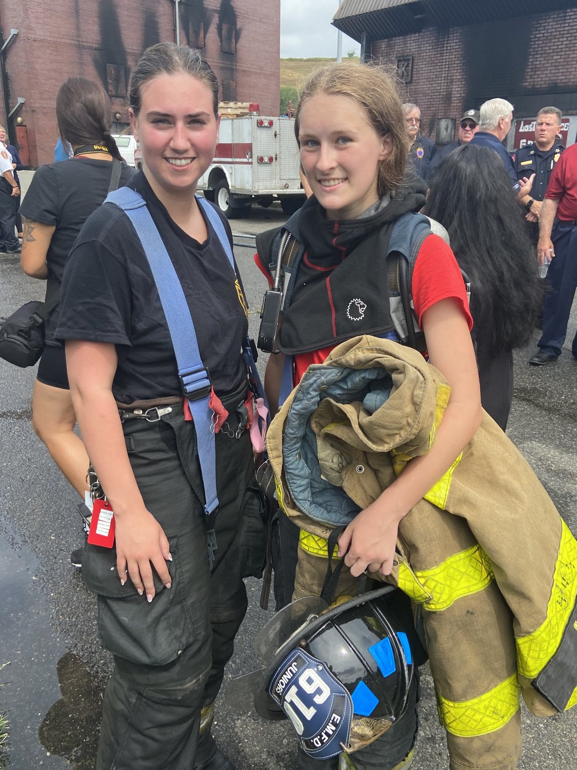Jenna Cody, far left, and Gabriella Koch represented the East Meadow Fire Department at Camp Fahrenheit 516.