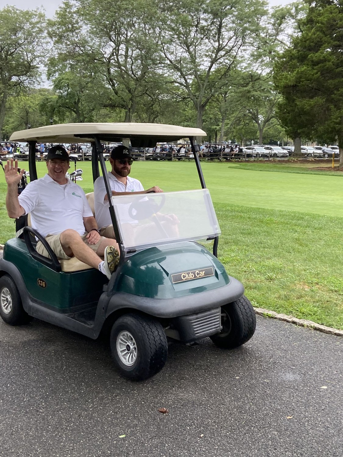 James Skinner Sr., far left, and his son, James, were ready to get their swings on at the annual Steven J. Eisman Memorial Golf Outing.