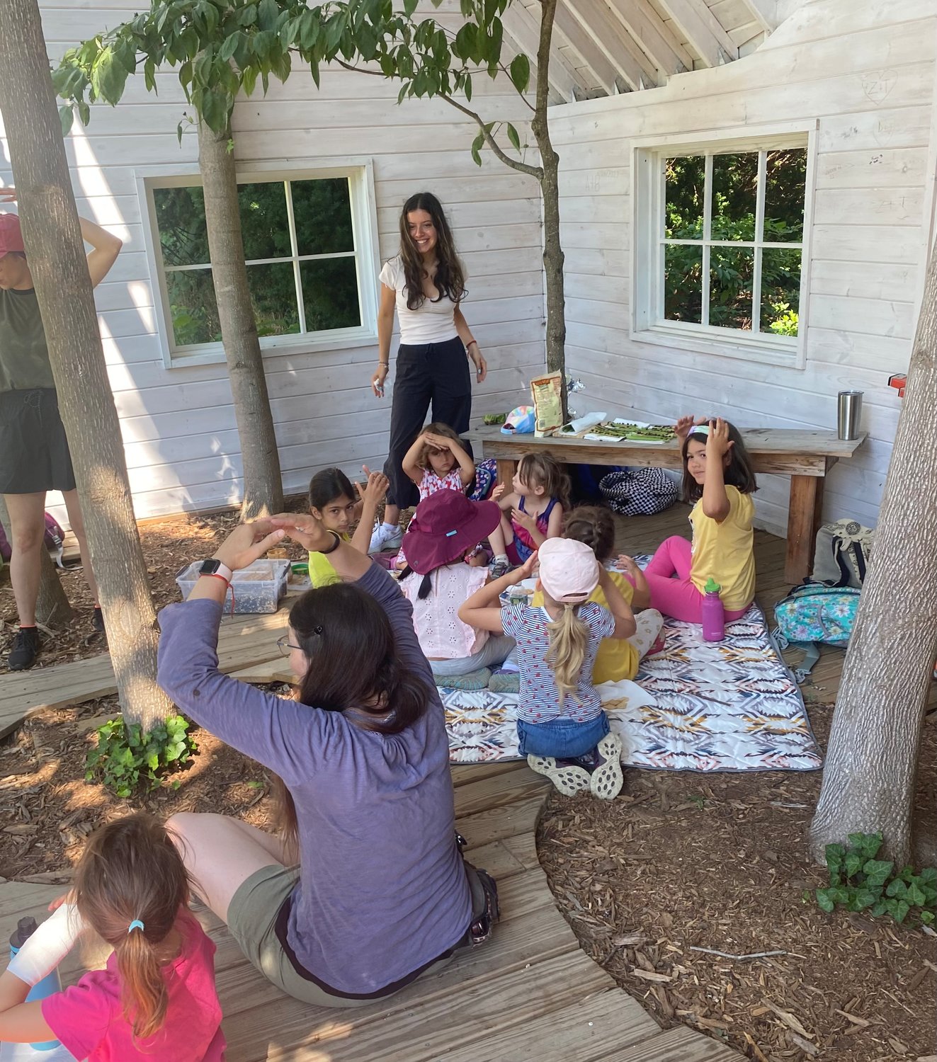 The Sparrows group sang a blessing song before eating their “ants on a log” snack consisting of celery, which they chopped themselves at Orkestai farm, raisins and peanut butter.