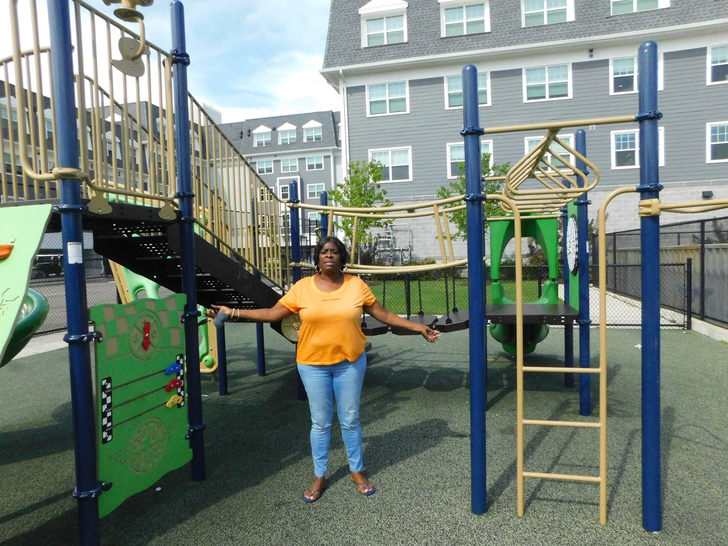 Charlene Ladson gestured toward the small fenced-in playground at the Moxey Rigby apartment complex. The playground does not accommodate older children.