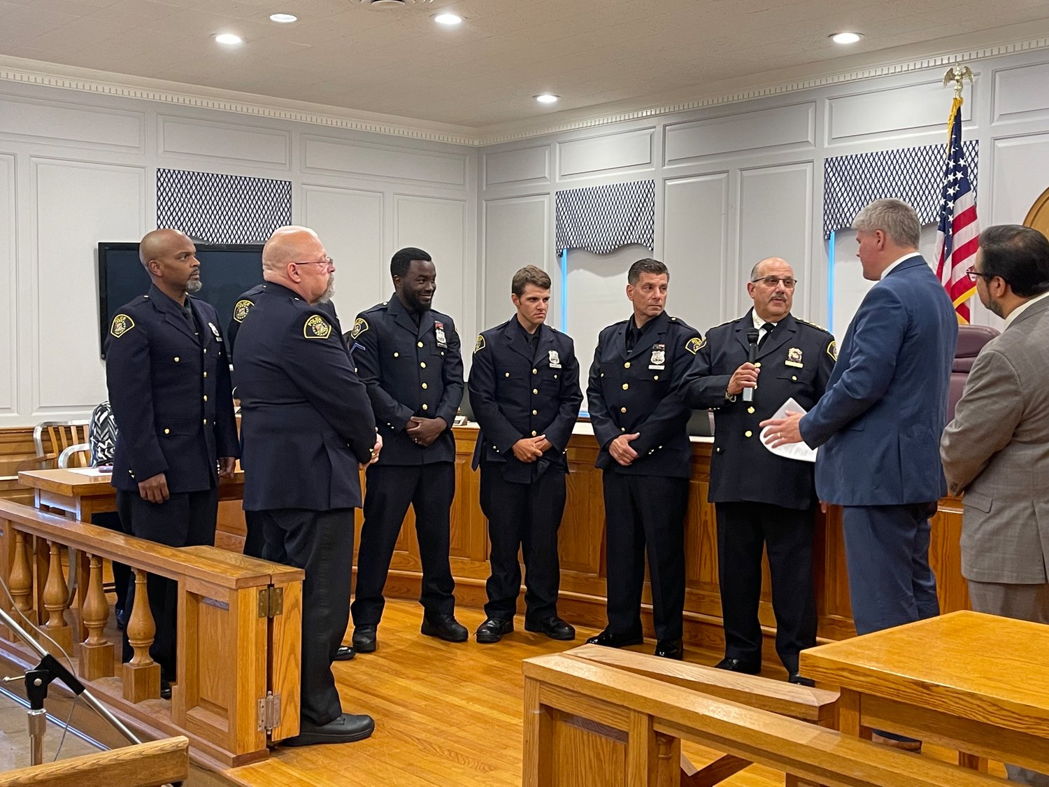 Malverne’s reserve police officers and mayor have credited the department’s success to Chief Robert Oliva, second from right.