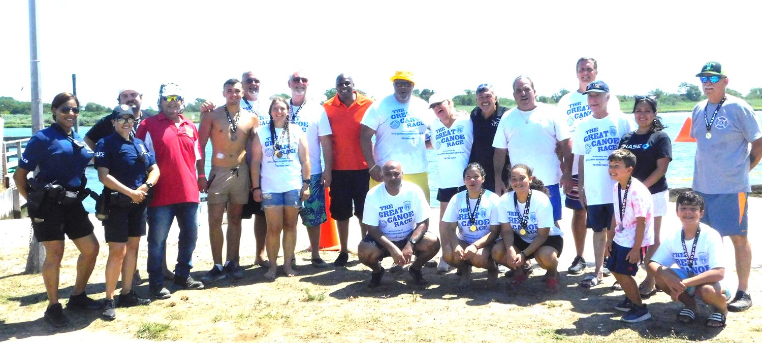Reine Bethany/Herald photos
Villagers, Community Affairs Division officers, and Chamber of Commerce officers with race organizer Marianne Endo, standing, seventh from right.