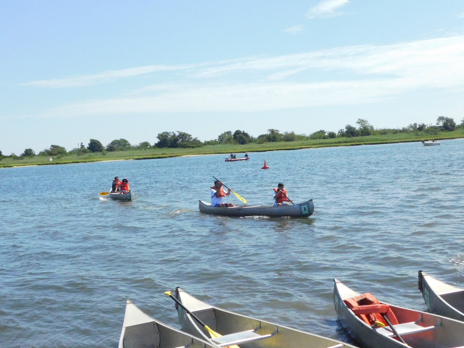 Paddlers carved through the waters off the beach at Cow Meadow Park in pursuit of medals.