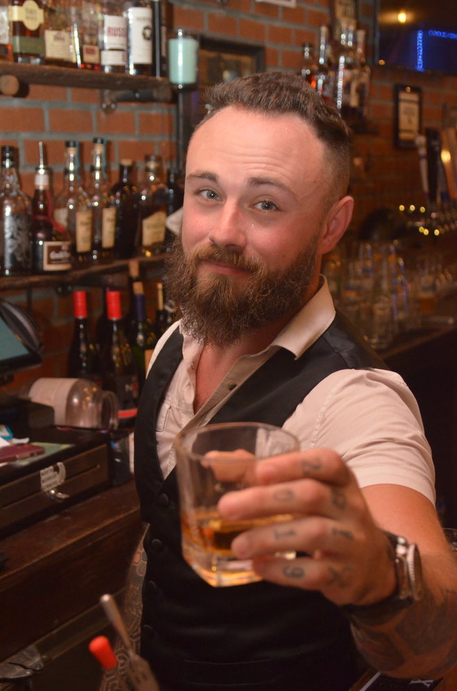 Bourbon & Brews’ owner John Amaruso whipped up a drink behind the bar.