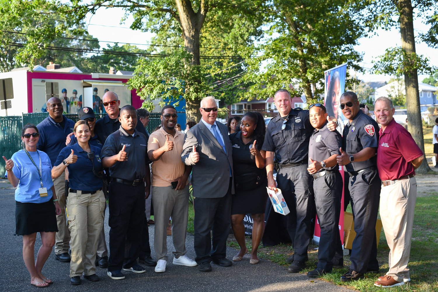 Mayor Kennedy, precinct officers, village trustees and administrators and community members at National Night Out in Bishop Frank O. White Park on Tuesday.