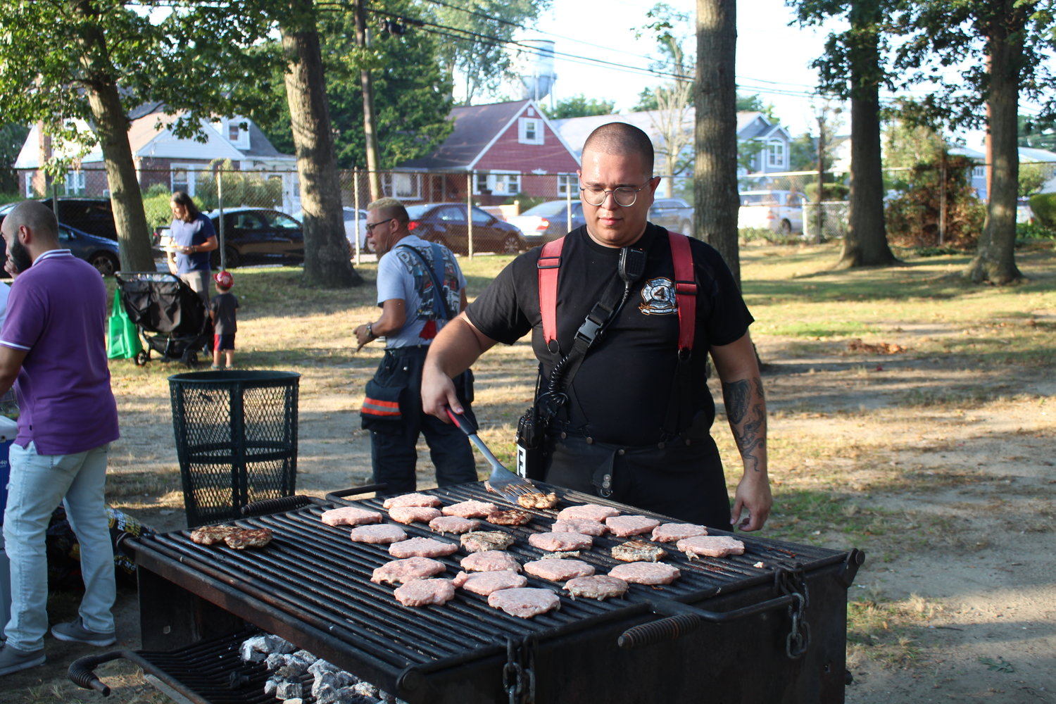 Freeport Firefighter Will Villalobos manned the grill at National Night Out on Aug. 2 at Bishop Frank O. White Park.