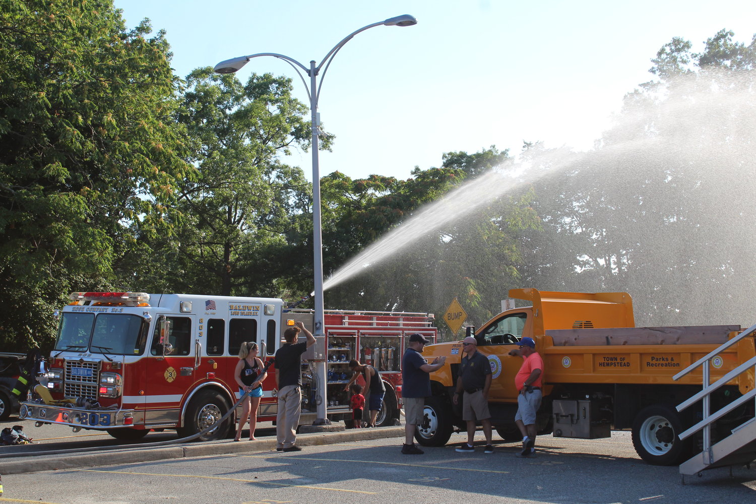 The Baldwin Fire Department cooled down National Night Out-goers while teaching them about the mechanics of operating a fire truck and offering passersby the opportunity to try out the hose.